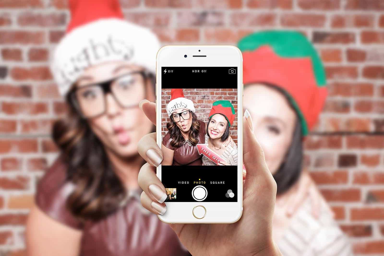 girls posing for Christmas lifestyle hashtag photo booth at Los Angeles photobooth rental LA