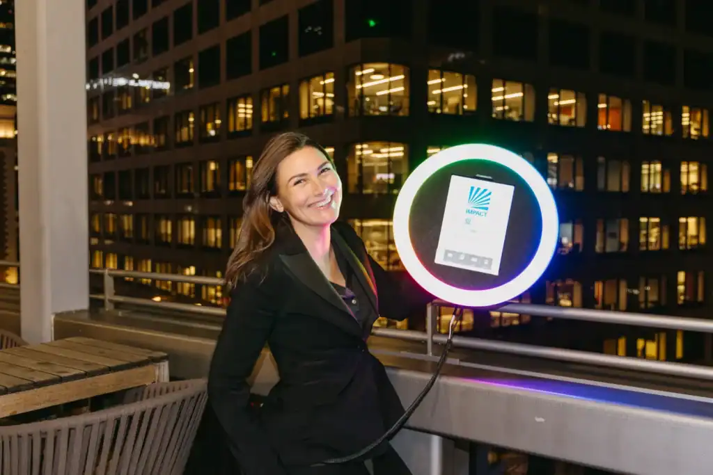 Guest being photographed at a rooftop event